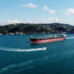 Aerial view of a cargo ship navigating through the Bosphorus Strait in Istanbul, Turkey.