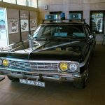 Classic police car exhibited at Ankara museum with historical displays.